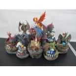 A set of "Council of Dragons" figurines along with castle stand, Danbury Mint