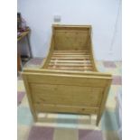 A pine single sleigh bed