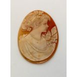 An oval unframed cameo of a young lady