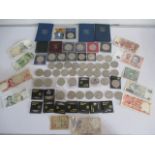 A collection of commemorative coins and banknotes etc