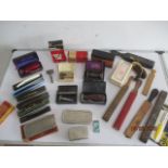 A collection of vintage razors and shaving related items