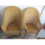 A pair of wicker chairs