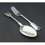 A hallmarked silver serving spoon along with a large silver fork. Total weight 176.4g