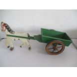 A vintage wooden horse and cart toy