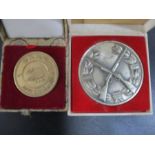 An SCM shooting medal along with a Chinese gold plated commemorative medal