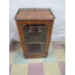 A Edwardian inlaid music cabinet with brass rail