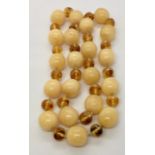 A 1970's Baltic two tone amber necklace, 113.5g