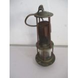 A unnamed miners lamp, stamped with 1272 1705