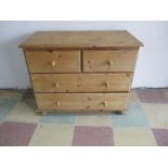 A low pine chest of four drawers