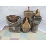 A quantity of wicker items including a stick stand, trays, planter, waste bin, picnic hamper etc