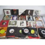 A collection of 7" vinyl singles including David Bowie, Queen, John Lennon, Pink Floyd, Rolling