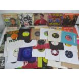 A collection of sixty 7" vinyl singles including Elvis Presley, Bob Marley, The Rolling Stones,