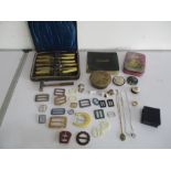 A collection of various items including cased knives and forks with silver mounts, buckles,