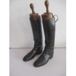 A vintage pair of Moss Bros.(Covent Garden) leather riding boots with wooden trees.