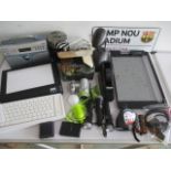 A collection of office equipment including Apple keyboard, desk lamp, guillotine, radio etc