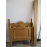 A chunky pine single bed