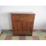 An oak sideboard with drawer over