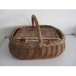 A large basket along with a small picnic basket