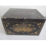 An Oriental lacquered box with gilded decoration, engraved lead lining to inside A/F