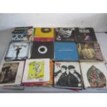 A collection of 7" vinyl singles including Queen, U2, Rod Stewart, Gary Moore, Free, Madonna, The