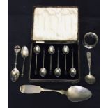 A cased set of silver coffee bean spoons along with a hallmarked silver serviette ring and 4 spoons