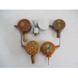 Five vintage novelty musical bottle stoppers.