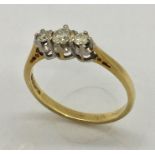 An 18ct gold diamond three stone ring