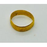 A 22ct gold wedding band. Weight 2.6g