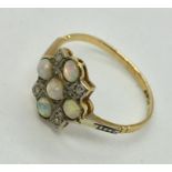 An 18ct gold and platinum diamond and opal cluster ring. Size O