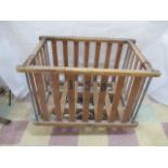 A vintage factory wooden slatted bobbin trolley.