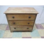 A pine chest of three drawers