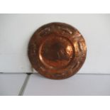 A Keswick style copper charger with Celtic style pattern