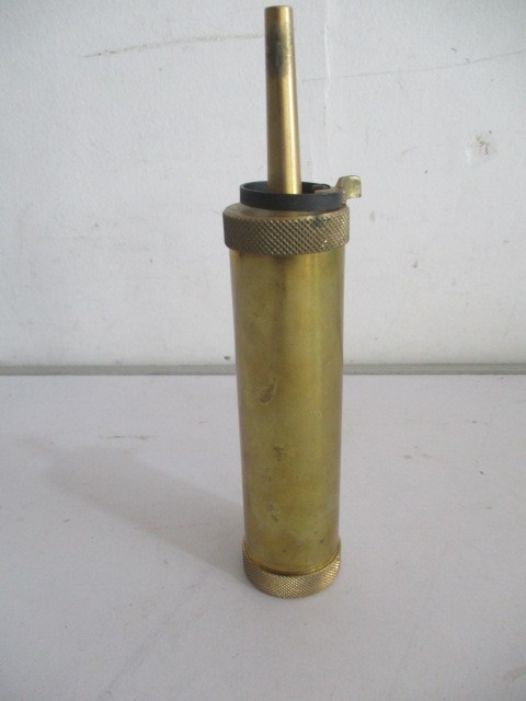 A brass Italian shot flask