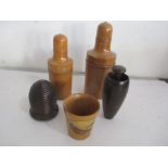 Five pieces of treen including a pestle and mortar, thimble holder etc.