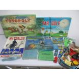 A collection of vintage games including Totopoly, Par-Golf, Waterloo, diecast cars etc