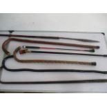 A small quantity of walking sticks, along with a whip, spear etc