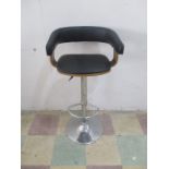 An Eames style bar stool