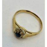 An 18ct gold sapphire and diamond cluster ring