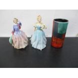 A Poole Pottery Vase, along with two Royal Doulton figurines of ladies including "Blithe