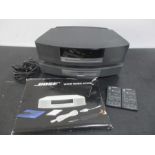 A Bose Wave Music system and multi-CD changer.