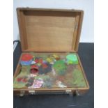A vintage artists paint box with contents