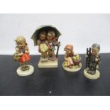 A collection of four West Germany goebel figurines.