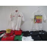 A collection of F1 and motorsport related clothing, t shirts, jackets, baseball cap ( signed) etc.