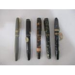 A collection of five vintage fountain pens including Cadet, Mentmore etc