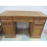 An Edwardian kneehole desk