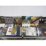 A collection of twenty three Beatles and solo related 12" vinyl records including The White Album,