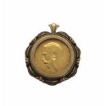 A 1911 half sovereign in 9ct mount. Total weight 7.9g