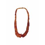 An amber fleck necklace, weight 111g