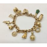 A 9ct gold charm bracelet with 11 charms, some unmarked. Total weight 52.3g