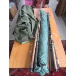 A collection of fishing rods including Darwa, Olympic, ABU, etc along with fishing carry bag